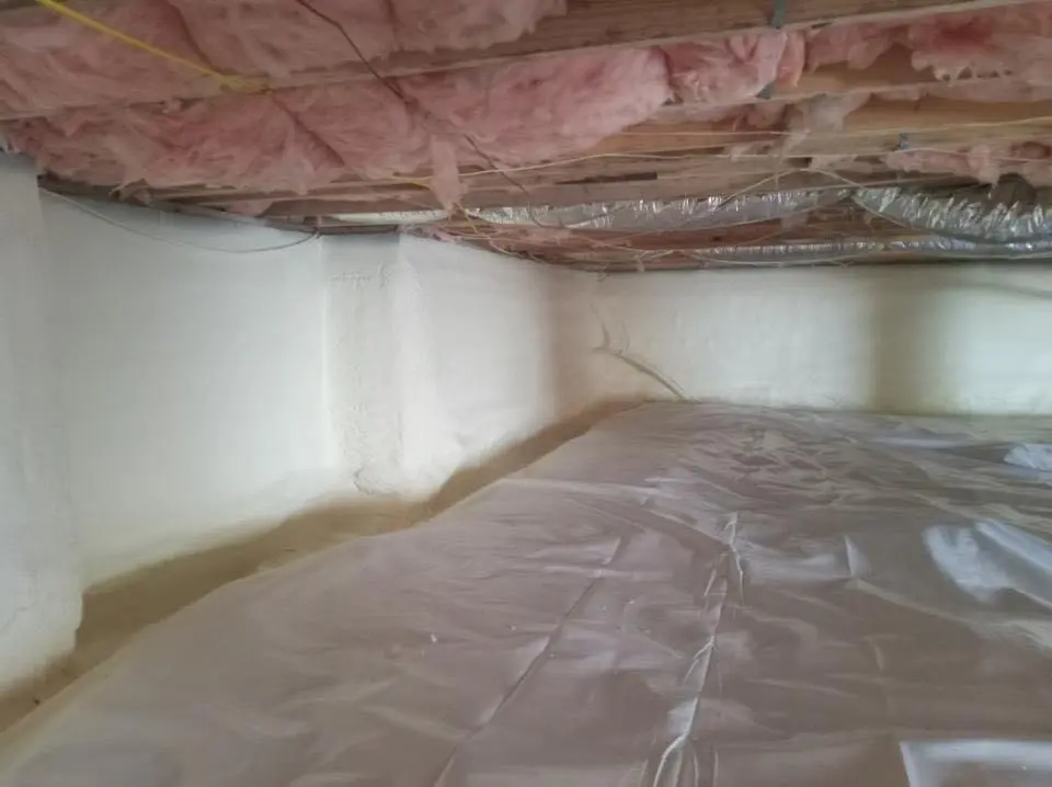 Crawl space encapsulation with closed-cell spray foam for Storm Damage Roof Repair in Clinton